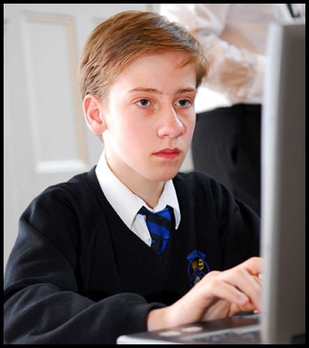 Teenage boy working at a computer
